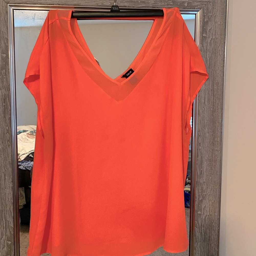 Short sleeve pink coral blouse. Sheer material